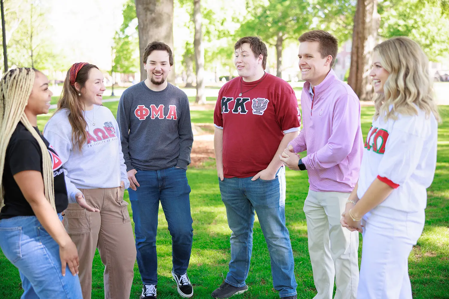 Fraternity and sorority students talking and laughing on the Quad